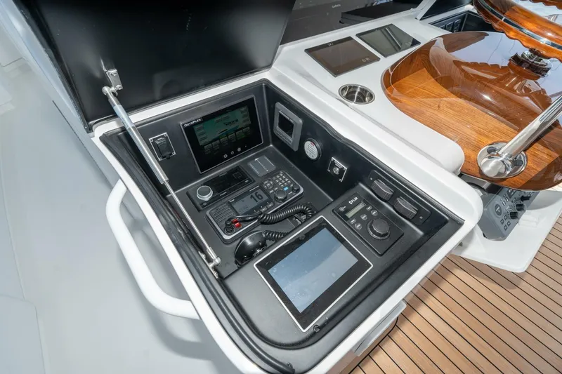 Slide: The Image of Control panel of 2025 Viking 90 Convertible yacht with advanced navigation systems. - 8