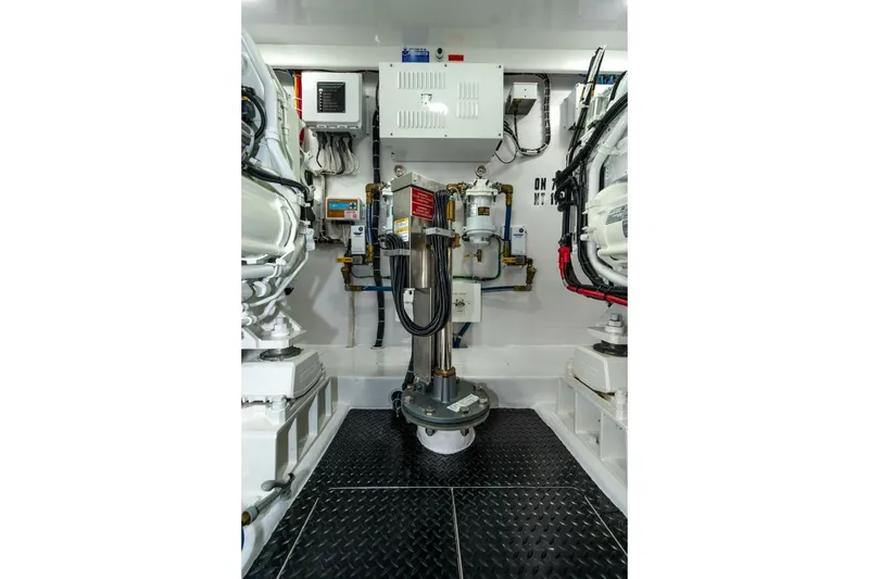 Slide: The Image of Engine room of 2025 Viking 90 Convertible yacht, showcasing advanced machinery and equipment. - 82