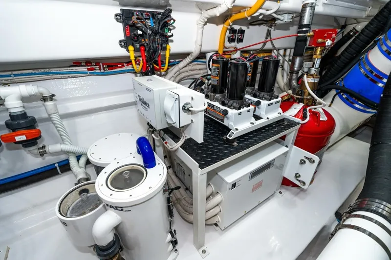 Slide: The Image of Engine room of 2025 Viking 90 Convertible yacht with advanced machinery and wiring. - 84
