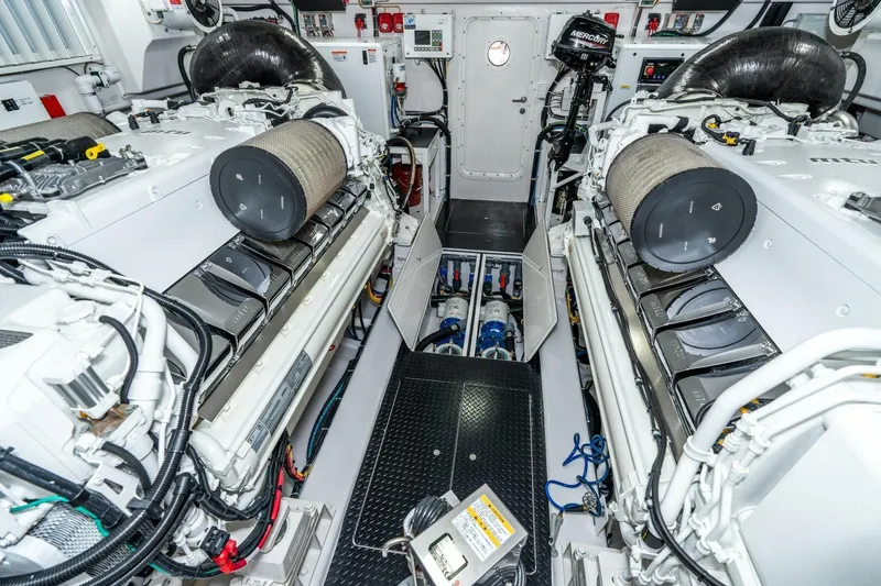Slide: The Image of Engine room of 2025 Viking 90 Convertible yacht, showcasing advanced machinery and equipment. - 85