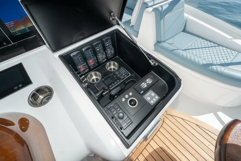Slide: The Image of Control panel of 2025 Viking 90 Convertible yacht with modern navigation equipment. - 9