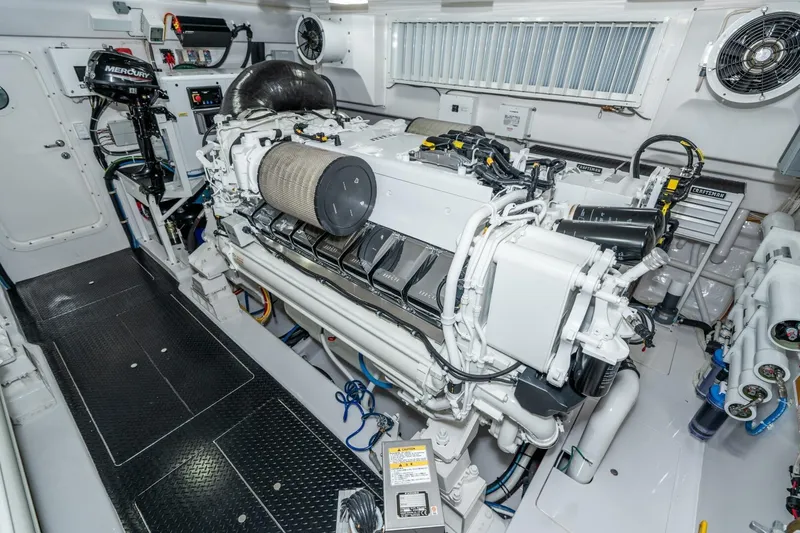 Slide: The Image of Engine room of 2025 Viking 90 Convertible yacht, featuring advanced machinery and equipment. - 90