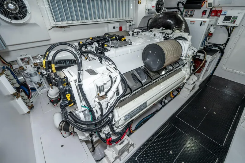 Slide: The Image of Engine room of 2025 Viking 90 Convertible yacht, showcasing advanced machinery and components. - 91