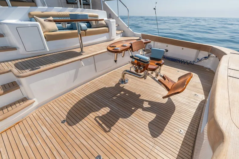 Slide: The Image of Luxurious 2025 Viking 90 Convertible yacht deck with fishing chair and ocean view. - 94