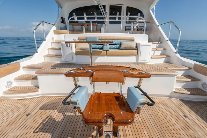 Slide: The Image of Luxurious 2025 Viking 90 Convertible yacht deck with elegant seating and ocean view. - 97