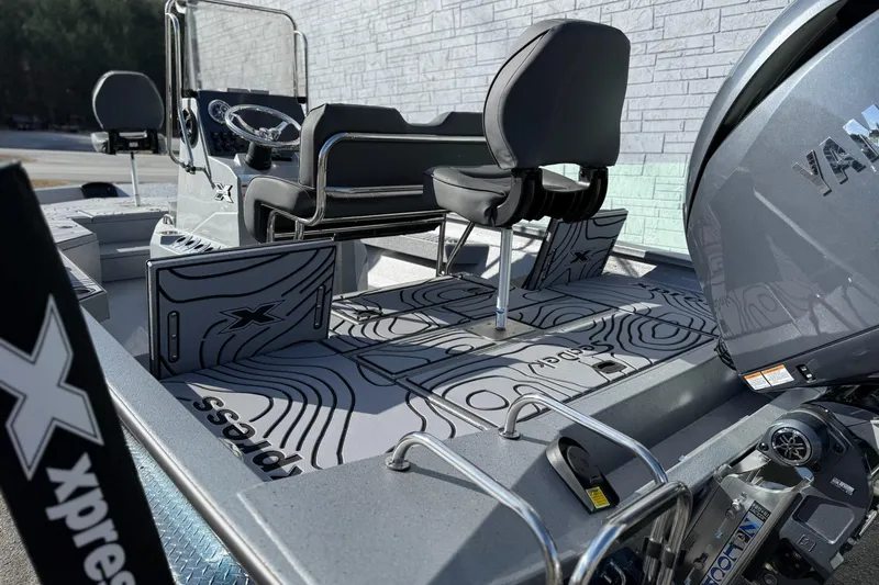 Slide: The Image of 2026 Xpress H20B Bay boat interior with Yamaha engine, featuring sleek seating and modern design. - 5