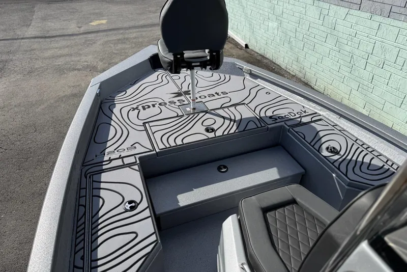 Slide: The Image of 2026 Xpress H20B Bay boat interior with SeaDek flooring and seating. - 9