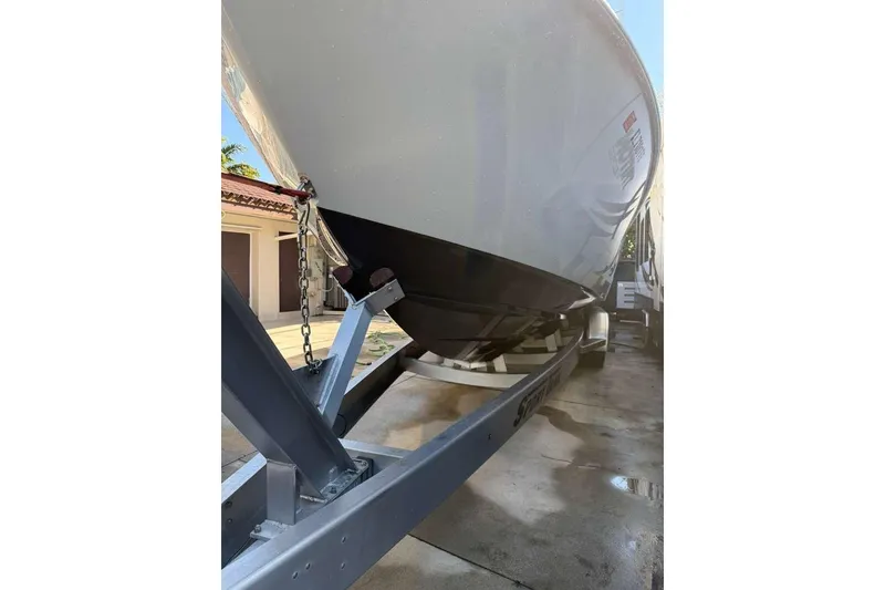 Slide: The Image of 2022 Contender 35 ST boat on trailer, parked in driveway. - 10