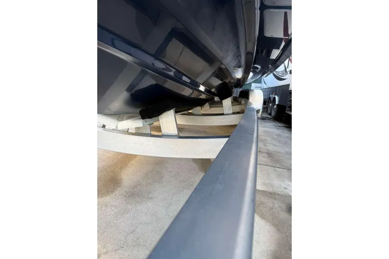 Slide: The Image of 2022 Contender 35 ST boat hull on trailer, close-up view. - 13