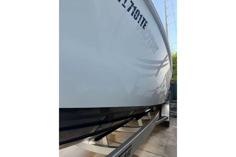 Slide: The Image of 2022 Contender 35 ST boat on trailer, close-up view of hull design. - 14