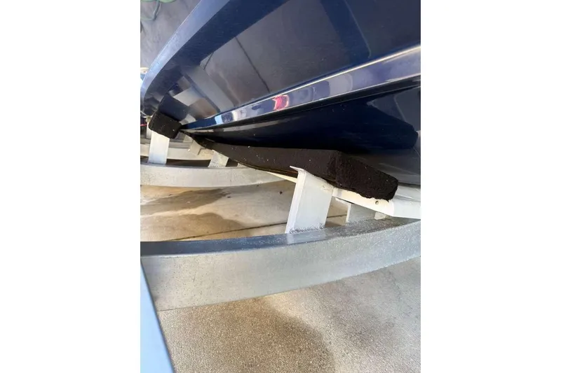 Slide: The Image of 2022 Contender 35 ST boat hull on trailer, close-up view. - 16