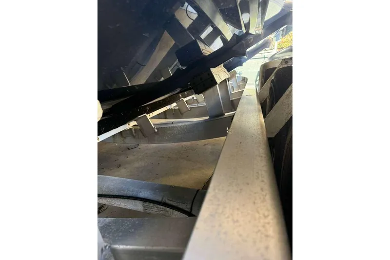 Slide: The Image of 2022 Contender 35 ST boat trailer close-up, showcasing structural details. - 17