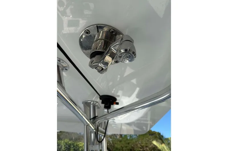 Slide: The Image of 2022 Contender 35 ST boat detail showing stainless steel hardware and canopy structure. - 27