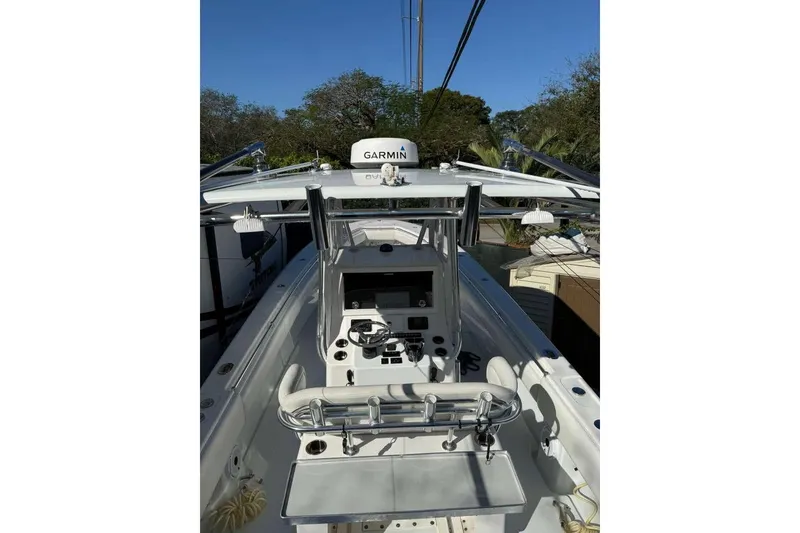 Slide: The Image of 2022 Contender 35 ST boat cockpit with Garmin equipment, sleek design, and modern controls. - 28