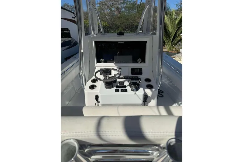 Slide: The Image of 2022 Contender 35 ST boat console with steering wheel and navigation equipment. - 29