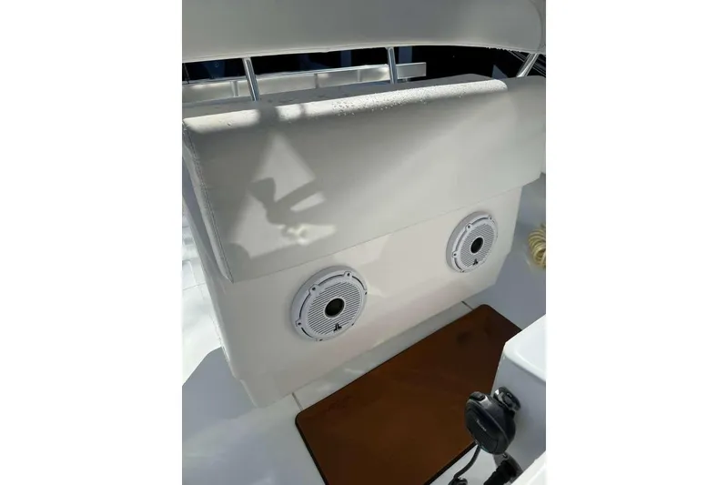 Slide: The Image of 2022 Contender 35 ST boat interior with dual speakers and cushioned seating. - 32