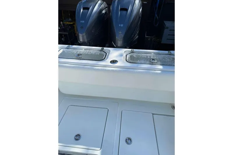 Slide: The Image of 2022 Contender 35 ST boat with dual V8 engines, rear deck view. - 33