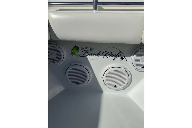 Slide: The Image of 2022 Contender 35 ST boat interior with "Bank Reef" logo and speaker system. - 36