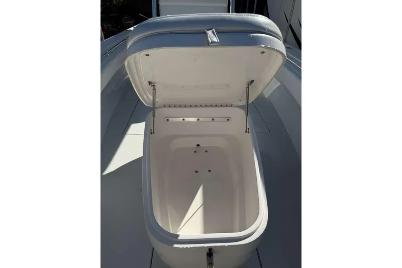 Slide: The Image of Open storage compartment on 2022 Contender 35 ST boat, showcasing interior space. - 40