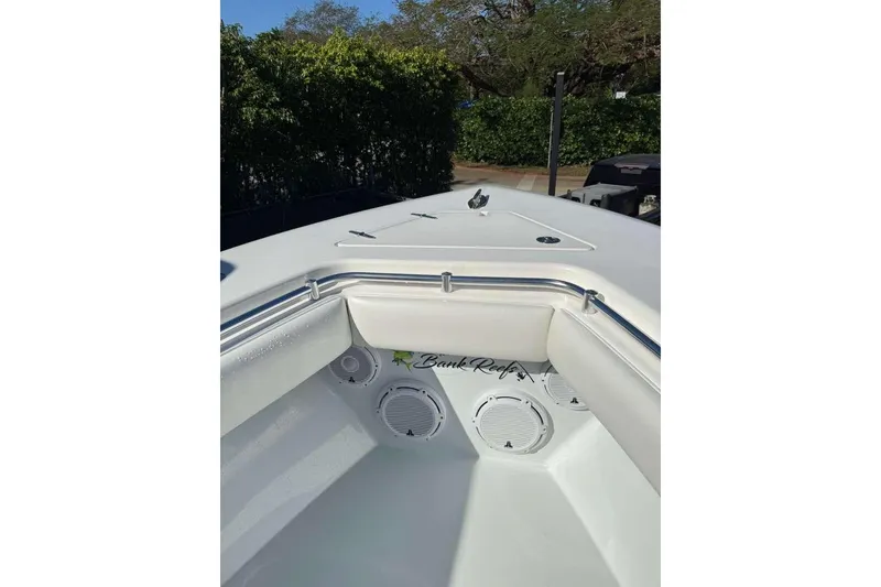 Slide: The Image of 2022 Contender 35 ST boat interior with speakers and cushioned seating. - 41