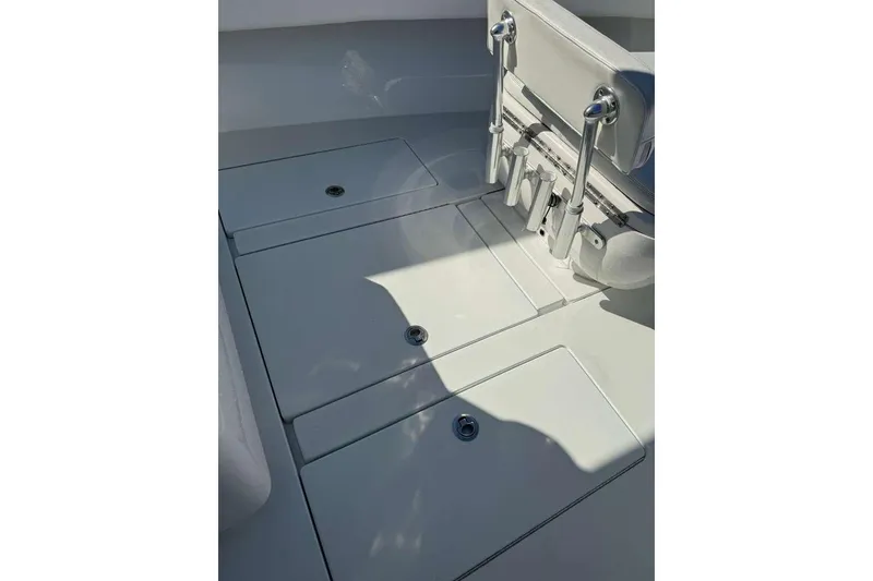 Slide: The Image of 2022 Contender 35 ST boat deck with storage compartments and rod holders. - 44