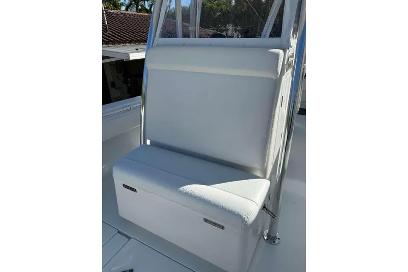 Slide: The Image of 2022 Contender 35 ST boat seat with white upholstery and stainless steel frame. - 48