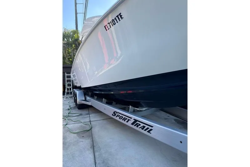 Slide: The Image of 2022 Contender 35 ST boat on Sport Trail trailer, side view. - 5