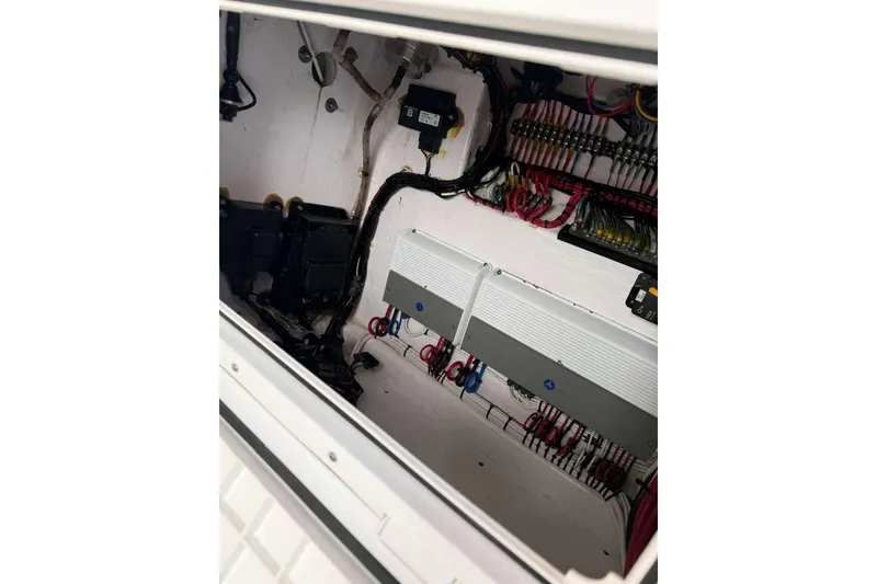 Slide: The Image of Electrical system inside 2022 Contender 35 ST boat, showcasing wiring and components. - 50