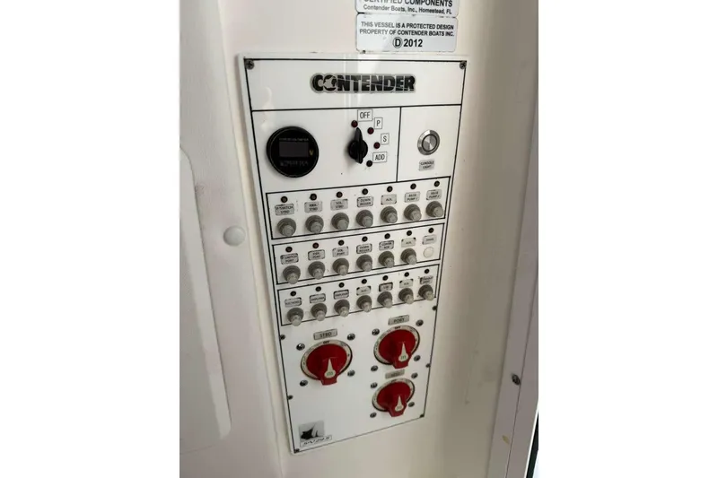 Slide: The Image of Control panel of 2022 Contender 35 ST boat with switches and dials. - 51