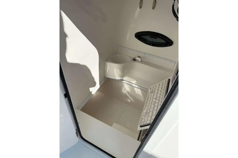 Slide: The Image of 2022 Contender 35 ST boat interior with compact sink and storage area. - 53