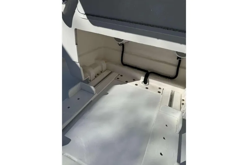 Slide: The Image of 2022 Contender 35 ST boat interior storage compartment, showcasing clean design and functionality. - 56