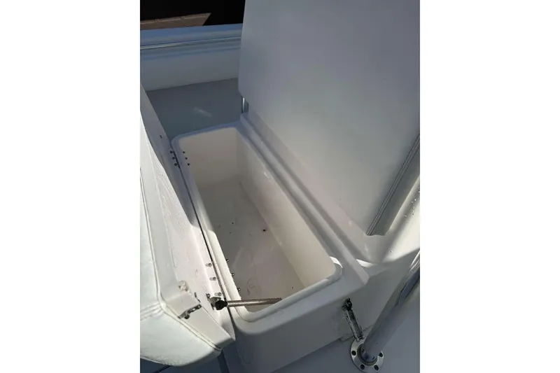 Slide: The Image of Open storage compartment on 2022 Contender 35 ST boat, showcasing interior space. - 57
