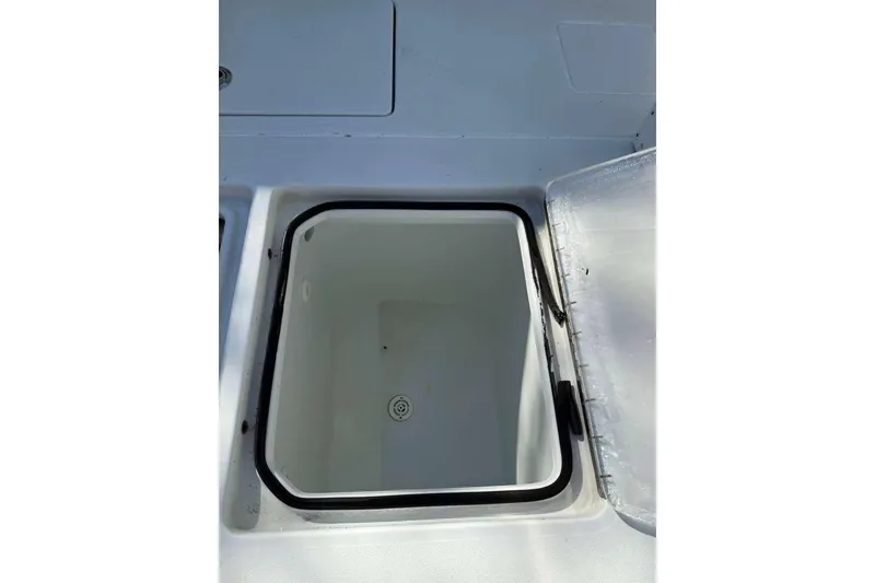 Slide: The Image of Open storage compartment on 2022 Contender 35 ST boat, showcasing interior space. - 59