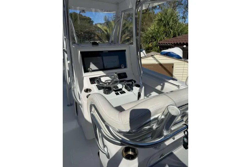 Slide: The Image of 2022 Contender 35 ST boat cockpit with modern controls and dual screens. - 62