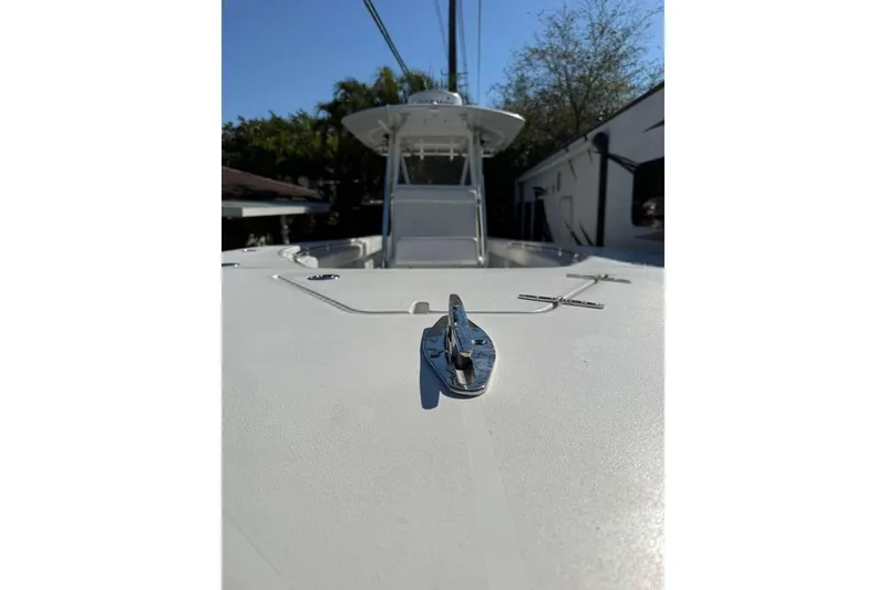 Slide: The Image of 2022 Contender 35 ST boat deck with cleat, sunny day, trees in background. - 8