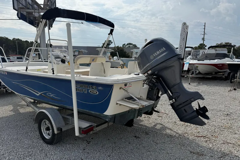 Slide: The Image of 2017 Carolina Skiff 218 DLV boat with Yamaha outboard motor on trailer. - 10