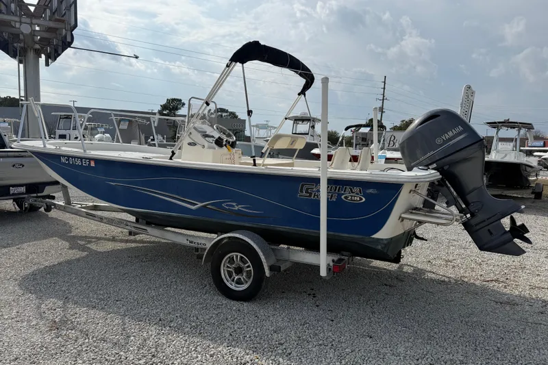 Slide: The Image of 2017 Carolina Skiff 218 DLV boat on trailer with Yamaha outboard motor. - 11