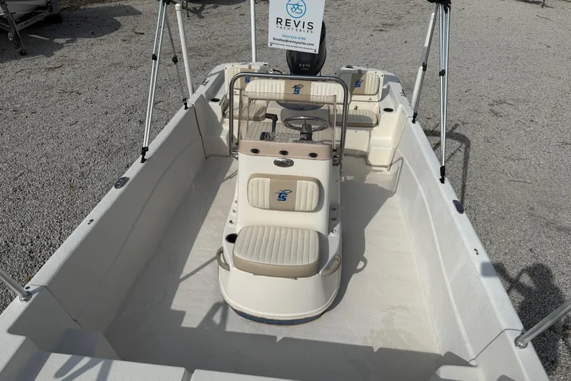 Slide: The Image of 2017 Carolina Skiff 218 DLV boat interior with seating and steering console. - 19
