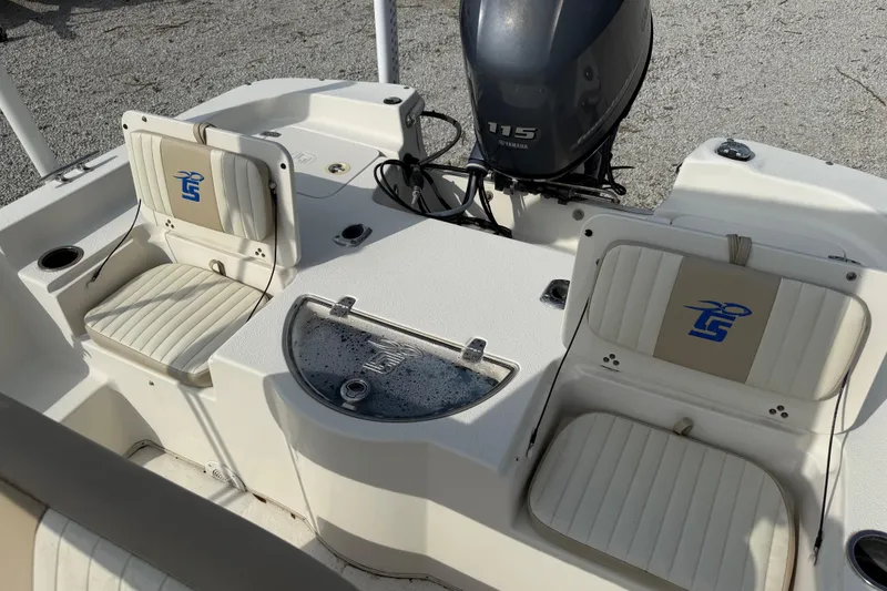 Slide: The Image of 2017 Carolina Skiff 218 DLV boat interior with Yamaha 115 engine and seating. - 24