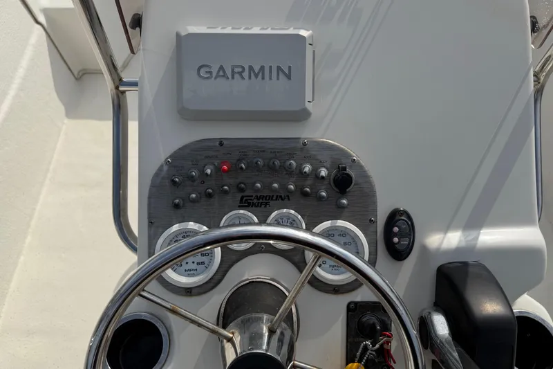 Slide: The Image of Control panel of a 2017 Carolina Skiff 218 DLV with Garmin navigation system. - 26