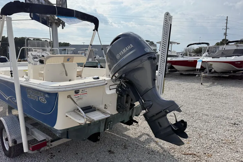 Slide: The Image of 2017 Carolina Skiff 218 DLV boat with Yamaha outboard motor on trailer. - 9