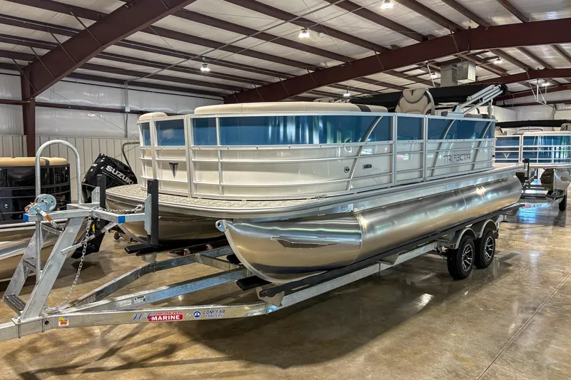 Slide: The Image of 2025 Trifecta 20RF LE pontoon boat on trailer in indoor showroom. - 10