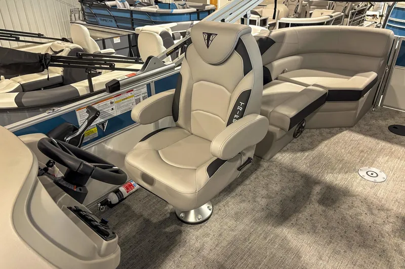 Slide: The Image of 2025 Trifecta 20RF LE boat interior with plush seating and modern steering console. - 6