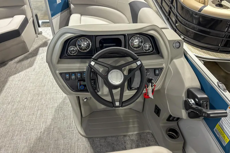 Slide: The Image of 2025 Trifecta 20RF LE boat dashboard with steering wheel and control panel. - 7