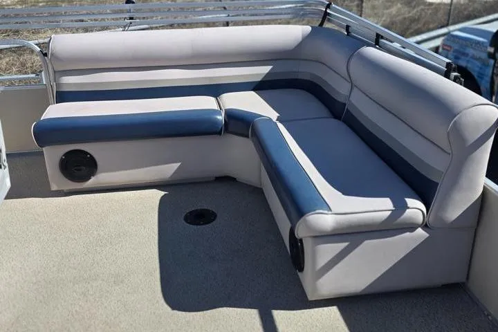 Slide: The Image of 2011 Weeres Cadet Fish 160 boat interior with cushioned seating and speaker. - 10