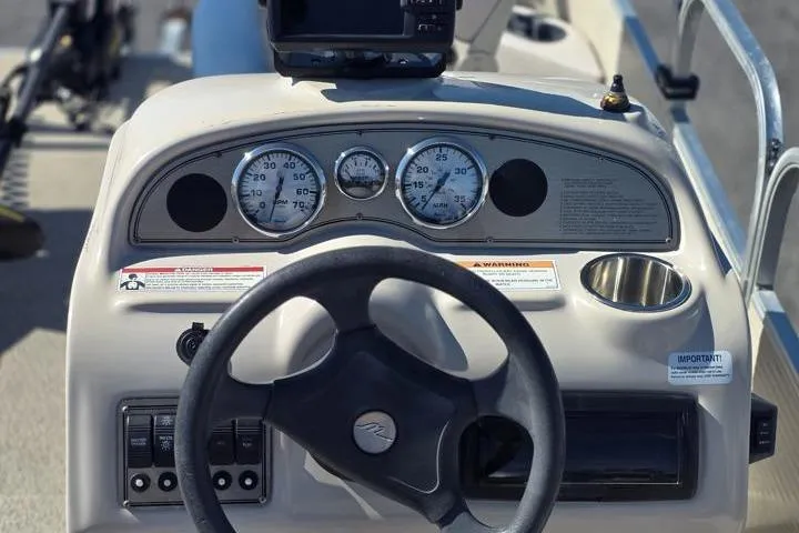 Slide: The Image of Steering console of 2011 Weeres Cadet Fish 160 boat with gauges and controls. - 15