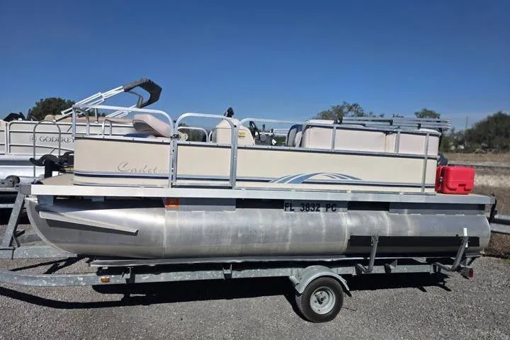 Slide: The Image of 2011 Weeres Cadet Fish 160 pontoon boat on trailer, sunny day. - 3