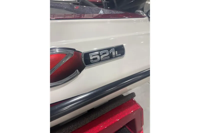 Slide: The Image of 2018 Ranger Z521L boat emblem on white exterior. - 11