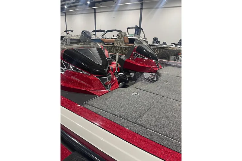 Slide: The Image of 2018 Ranger Z521L boat with red accents in showroom setting. - 2