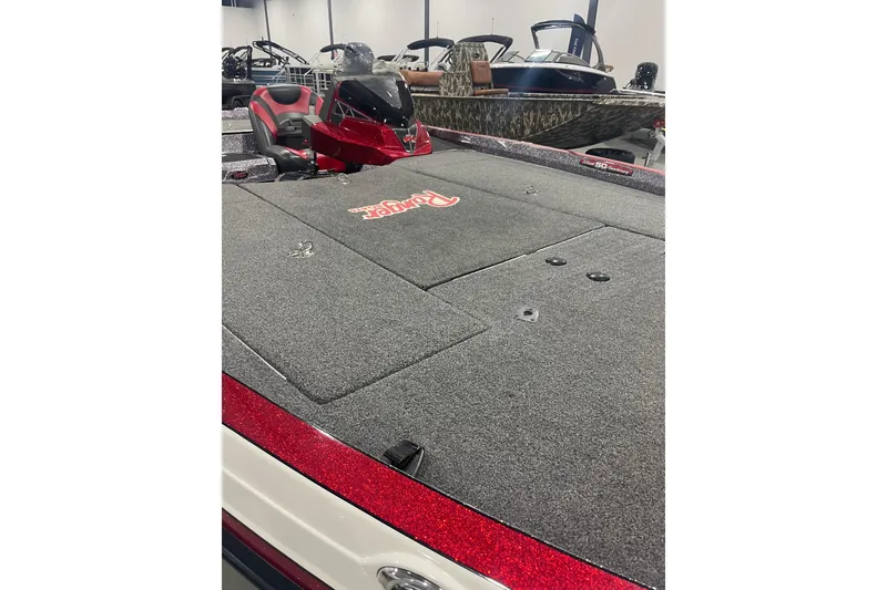 Slide: The Image of 2018 Ranger Z521L bass boat with carpeted deck and red accents in showroom. - 3